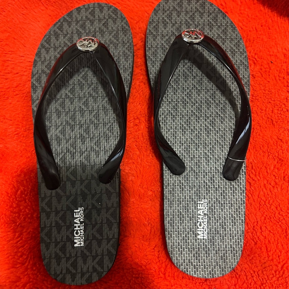 Michael Kors Black Flip Flop Sandals with Silver Logo